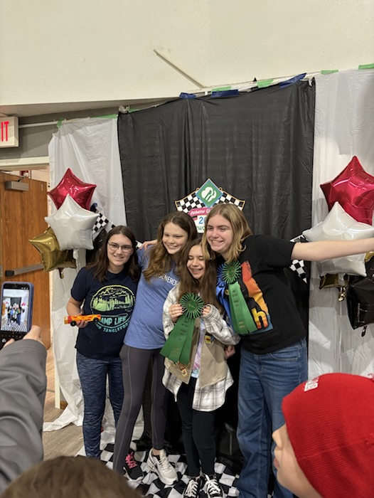 Scouts posing together at the race-day photo booth.